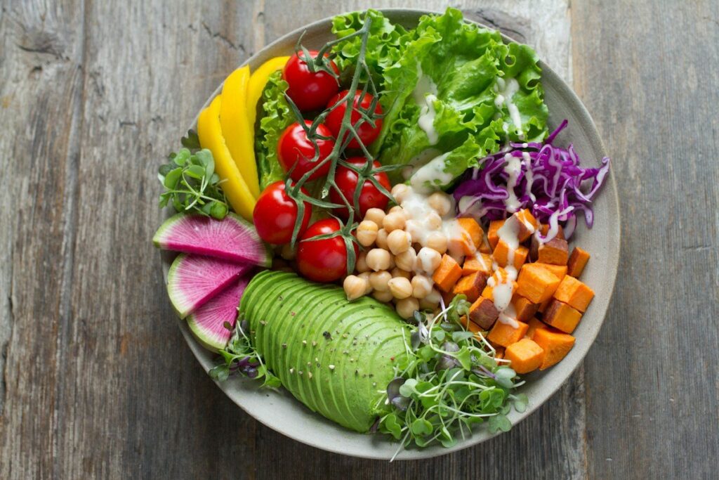 A bowl of mixed vegetables, salad and pulses